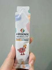 Argenix Neuroglow kids formula box and sachet for brain, cognitive, and speech support, with orange slices, blueberries, and playful cartoon graphics.