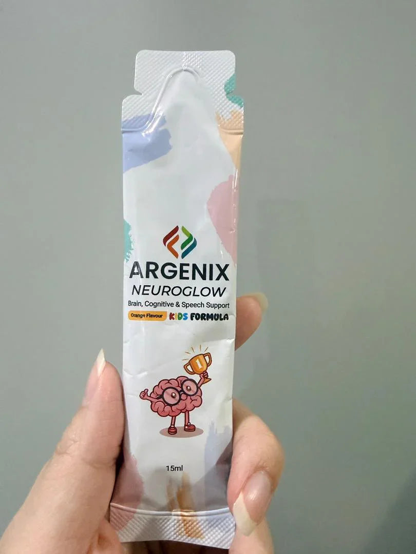 Argenix Neuroglow kids formula box and sachet for brain, cognitive, and speech support, with orange slices, blueberries, and playful cartoon graphics.
