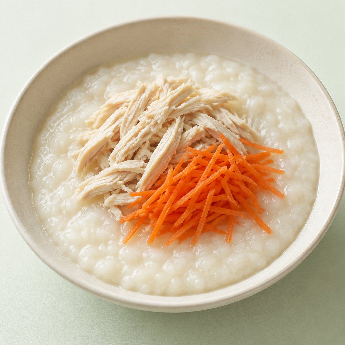 Illustrated bowl of chicken rice porridge
